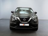 the front view of a black nissan murano parked in a showroom