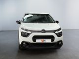 the front of a white citrole parked in a white room