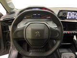 the interior of a car with a steering wheel and dashboard controls