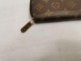 an image of a louis vuitton wallet on a white surface