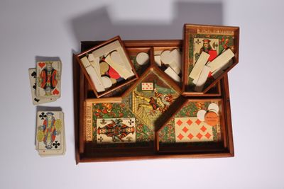 a wooden box with playing cards and a box of playing cards