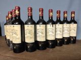 six bottles of wine are lined up on a wooden table