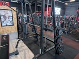 a gym with a lot of machines in the room