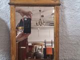 a person taking a picture of a mirror with a cell phone