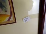une photo d'une photo représentant un chat accrochée au mur
