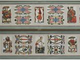 deux broderies au point de croix, de couleurs et de motifs différents, accrochées au mur