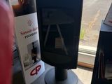 a television sitting on a stand in front of a window