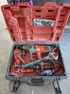 a tool box with tools inside of it on the floor