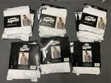 six pairs of white men ' s underwear are on a table