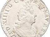 a silver coin with an image of a man on it
