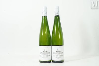 two bottles of wine sitting next to each other on a table
