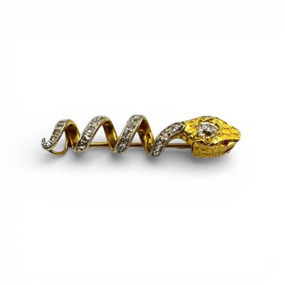 Broche serpent en or jaune (750) serti de rubis et diamants. - Photo 1