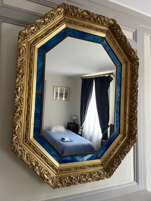 a mirror that is hanging on the wall in the room