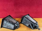 two pieces of glass on a table with a red background