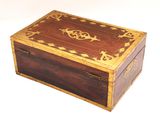 a small wooden box with a decorative design on it