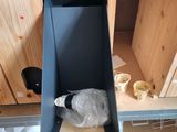 a small cabinet that has a door open on the inside