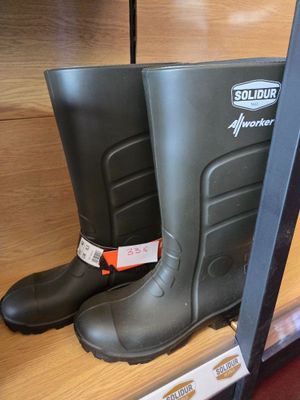 a pair of rubber boots on display in a store