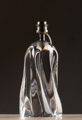 a glass bottle that is sitting on top of a table