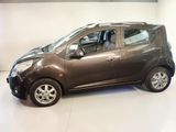 a picture of a small car parked in a showroom