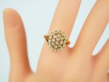 a close up of a person ' s hand with a ring on it