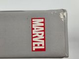 someone is holding a box with a marvel logo on it