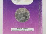 a close up of a box with a coin on it
