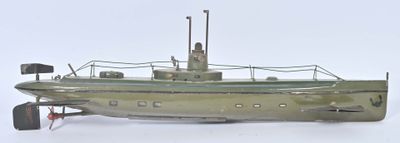 a small model of a boat on a white surface
