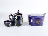 three pieces of blue pottery sitting next to each other