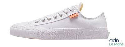 a close up of a pair of white sneakers on a white background