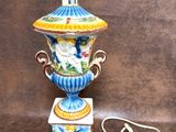 a lamp that is sitting on a table with a cord attached to it