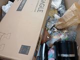 a cardboard box full of assorted items on the floor