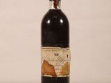 a bottle of wine that is sitting on a table