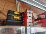 a metal shelf that has many different types of tools on it