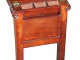 a small wooden table with a drawer on top of it