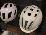 two helmets that are sitting on a shelf in a store