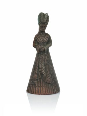 figurine in the form of a woman in a dress