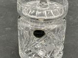 an image of a clear glass jar with a black label on it