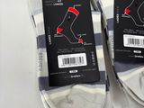 three pairs of men ' s socks are on display in a store