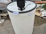 a white bucket with a radio in it on the ground