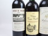 three bottles of wine sitting next to each other on a table