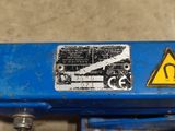 a sign on the back of a blue machine