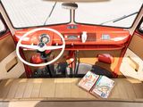 a red car with a steering wheel and a book in it