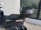 a scooter that is parked outside of a building