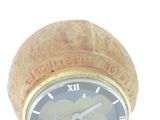 a clock that is sitting on top of a cork