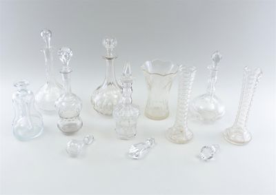 a lot of glass vases that are sitting on a table