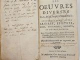 an open book with a handwritten title on it
