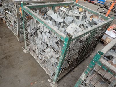 many pieces of metal in a cage on the ground