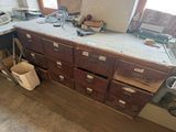 an image of a work room with a lot of work on the counter