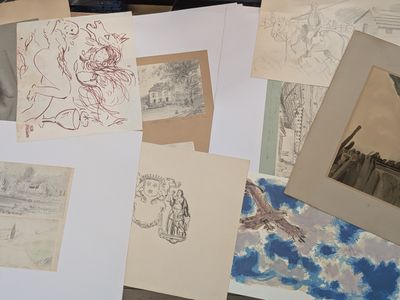 a lot of drawings and pictures on the table