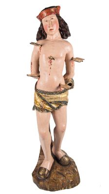 figurine of a man holding a knife and a knife in his hand